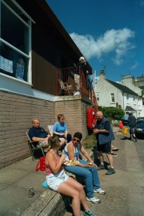 Members enjoying some summer sunshine outside the clubhouse in between training sessions
